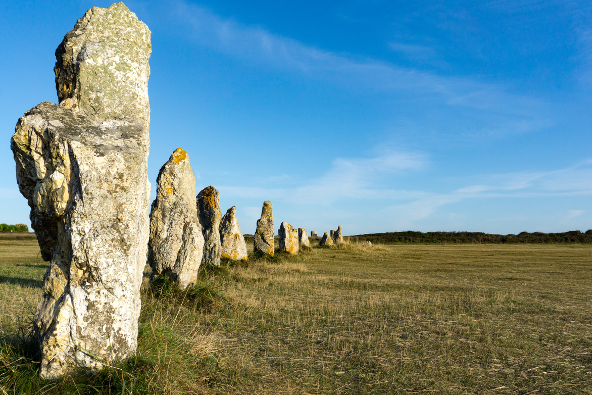 the standing stone alignements of Lagatjar in Brittany in soft morning light
